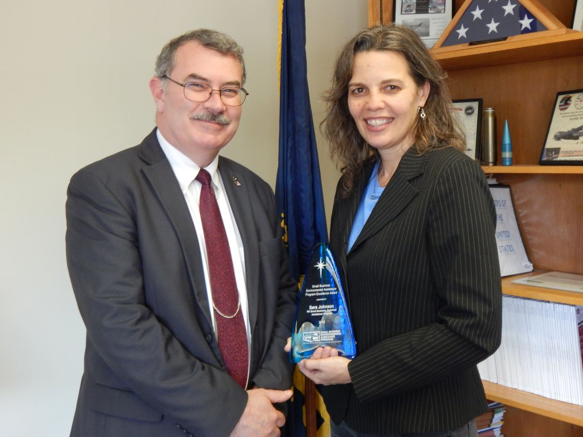 Robert S. Scott, Commissioner, N.H. Department of Environmental Services and Sara J. Johnson, N.H. SBEAP Manager posing for picture with award.