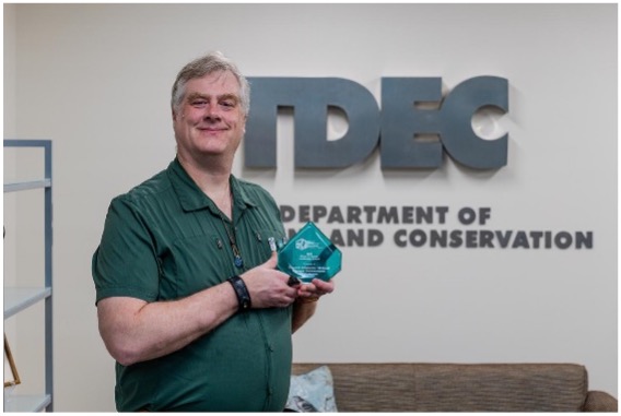 Donovan Grimwood with award